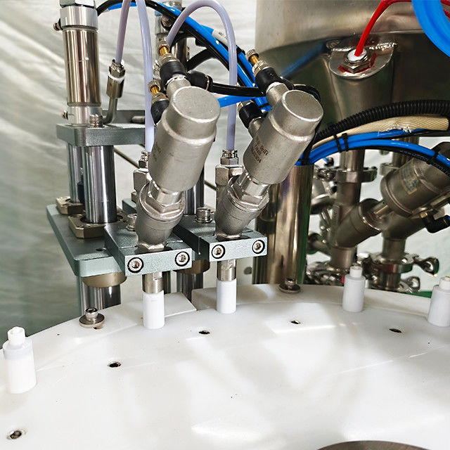 Macchina di riempimento pneumatica a due teste e di copertura a vite per gel di olio liquido a piccole dosi da 10 ml